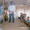 Feeding Hungry Children in a Hut